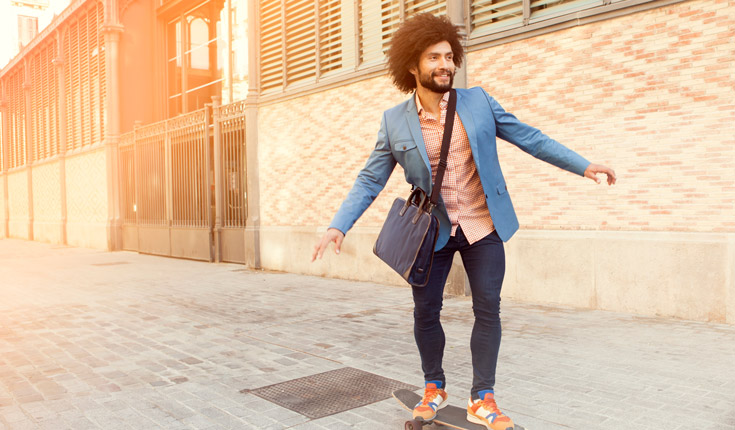 Man on skateboard in blue suit