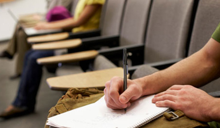 student taking notes
