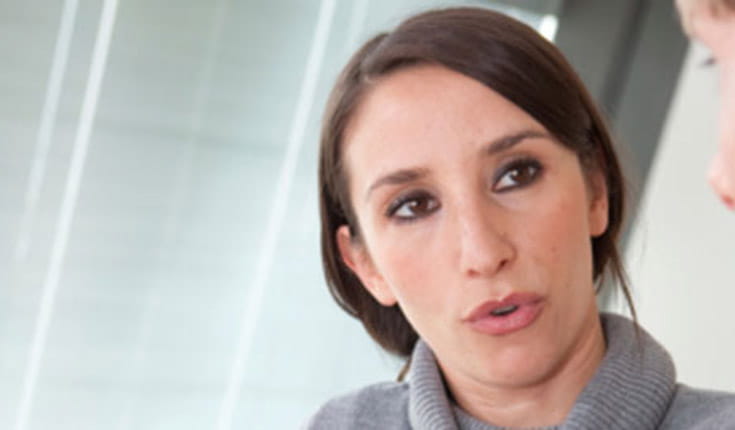 Woman with Black hair talking