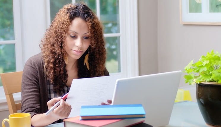 woman-sat-at-desk-studying