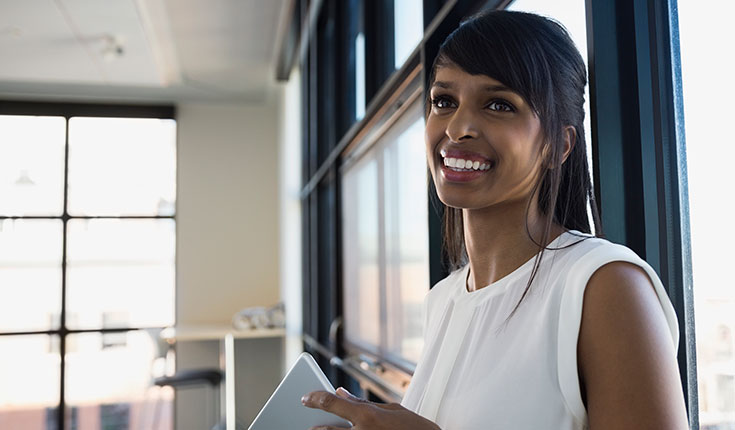smiling woman with tablet
