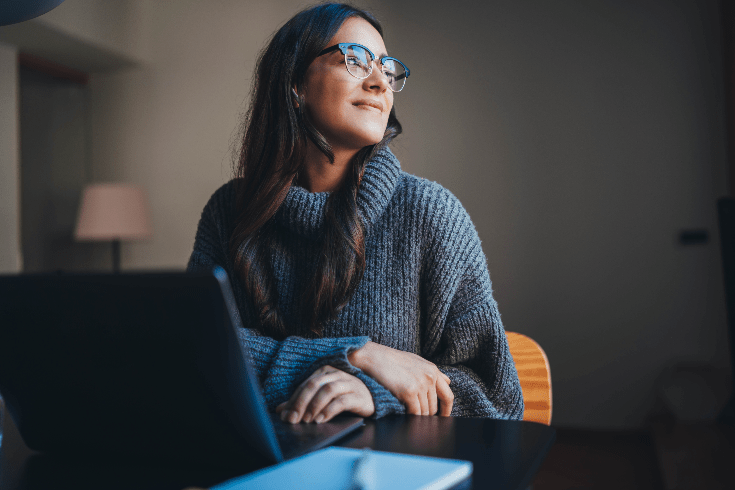 Women looking past her computer