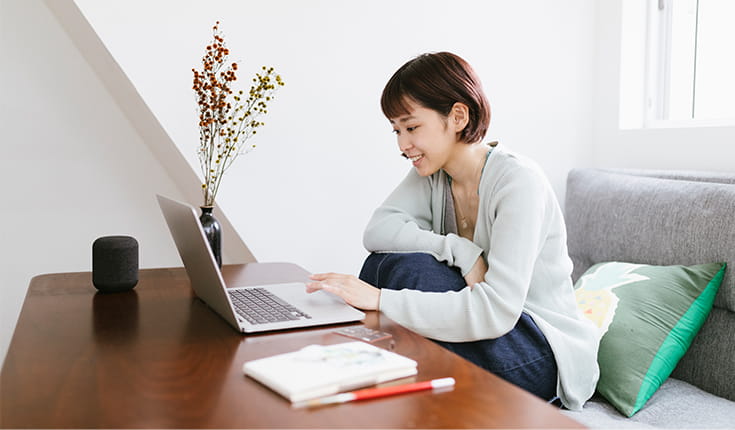 Smiling Woman at Laptop