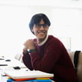 smiling student with glasses
