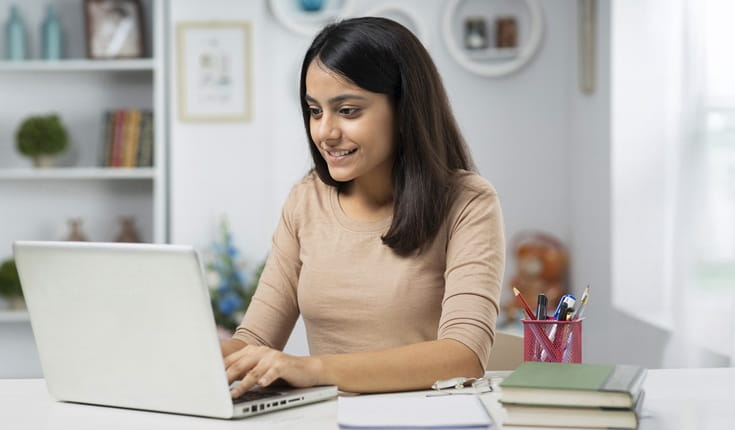 lady-sat-at-laptop-nmat